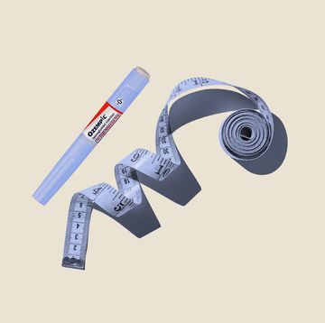 Measuring tapes on beige background measuring tapes on beige background
