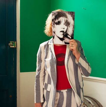 Gina Birch holds a photo of herself gina birch holds a photo of herself