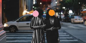 street style portrait of two young, fashionably dressed mixed race latina women on the streets of downtown los angeles, just having a walk of maybe going out for a dinner together