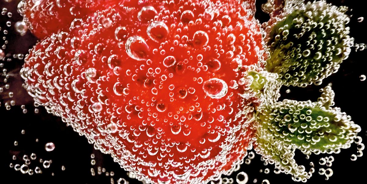 strawberry submerged in soda strawberry submerged in soda