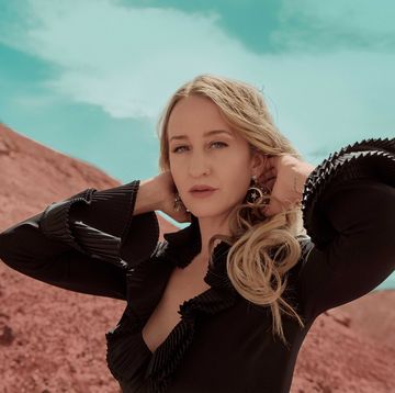 Margo Price stands in front of a red sand mountain margo price stands in front of a red sand mountain
